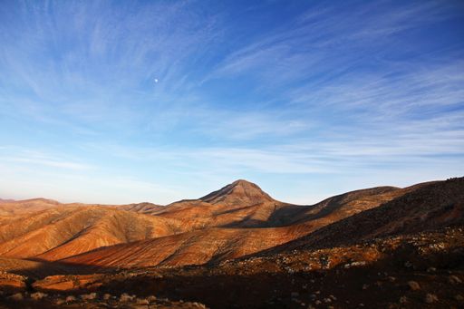 A beautiful shot of deserted mountains under a blue sky at daytime