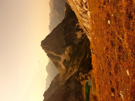 A vertical shot of rocky hills of the Mieming Range during the sunset in Austria