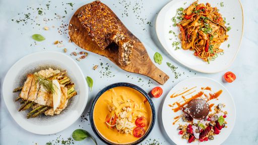 A top view of assorted dishes on a white table