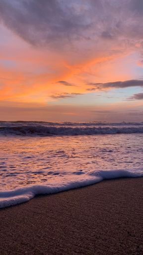 A scenic view of the beautiful sunset on a beach in Bali, Indonesia