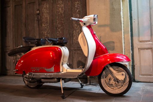 BANGKOK, THAILAND - MARCH 26, 2017: Lambretta scooter parked on a sidewalk in Bangkok, Thailand on March 26, 2017.