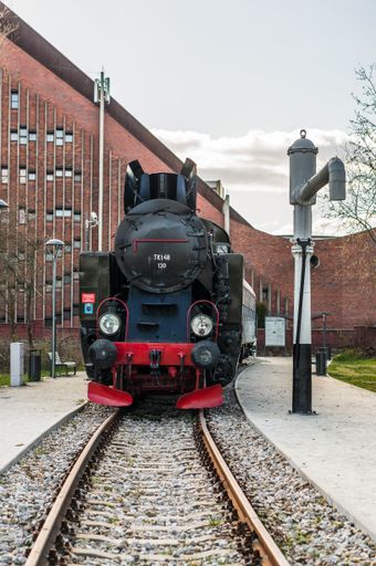 Front of a old exposition locomotive on a track in the Rataje park.