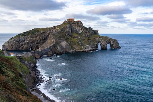 An aerial shot of San Juan de Gaztelugatxe islet surrounded by Atlantic Ocean, Bermeo, Basque Country, Spain
