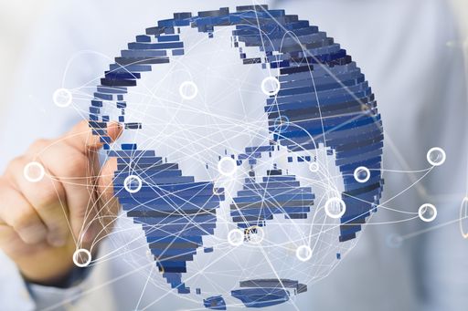 A person pointing at 3D render of global network and data exchanges over the world