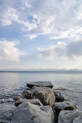 A mesmerizing view of Lake Sevan and the cloudy blue sky