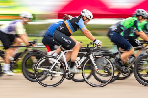 Cyclists racing in a road bike crit at a public park near Dallas, Texas