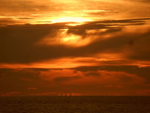 The mesmerizing view of the calm ocean during sunset