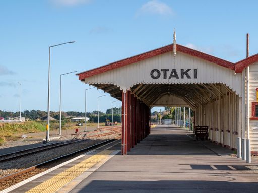 Otaki Railway Station in Kapiti, a wooden structure needing maintenance, usually quiet except for commuter trains.
