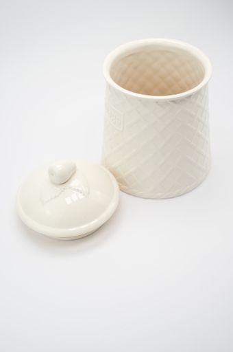 A vertical shot of a ceramic pot isolated on white