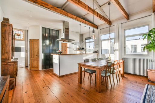The kitchen and the dining room of a modern apartment