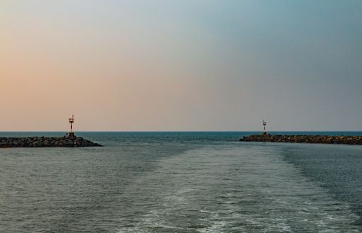 A beautiful scenery of rocky docks in the middle of the sea