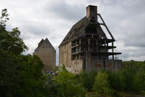 The cloudy sky over the ruined Lindenau harbor storage in Leipzig, Germany