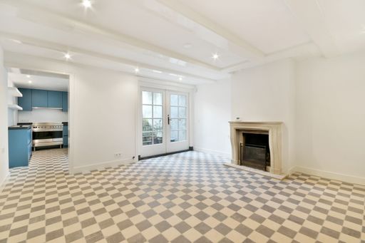 A beautiful modern interior design for an empty room with a fireplace in natural colors