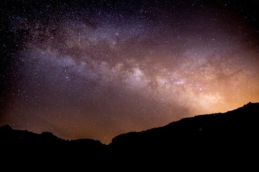 A beautiful starry galaxy sky over mountains