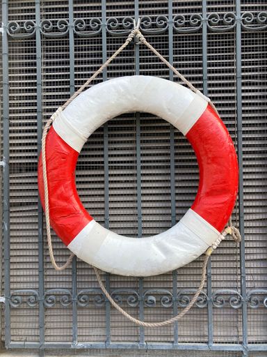 Classic vintage lifebuoy as decoration in red and white