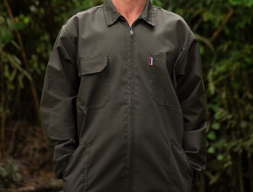 A male in a dark green jacket with his face and legs non-visible