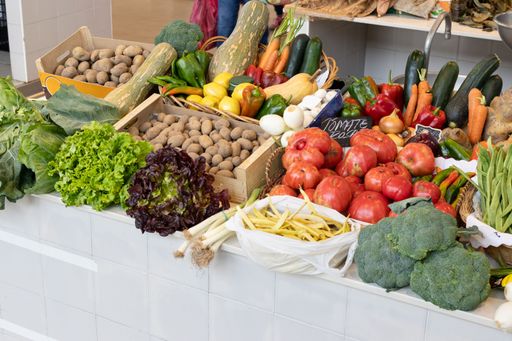 The fresh and colorful vegetables are displayed on a market stall