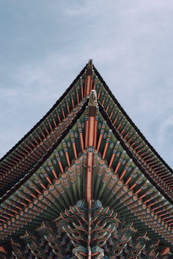 A low angle shot of the roof of the Gyeongbokgung Palace in Seoul, South Korea