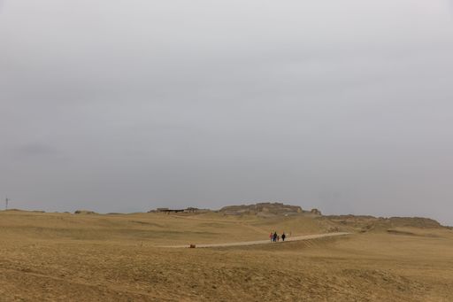A landscape view of a stone desert beneath a grey sky