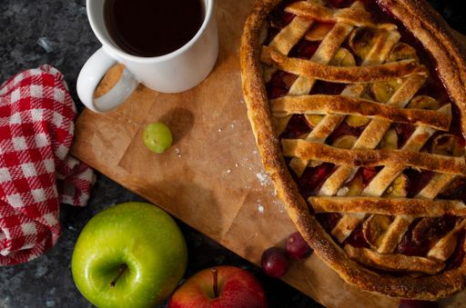 A high angle shot of delicious homemade apple pie and a cup of coffee