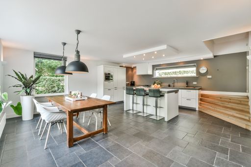 A large modern kitchen interior in white colors