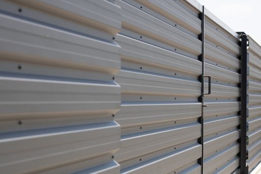 A closeup shot of a corrugated metal fence