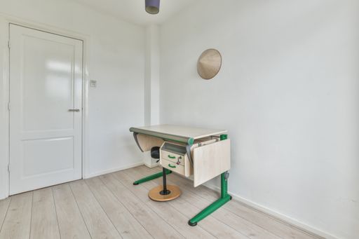 A modern room with furniture and the bright light coming from the window