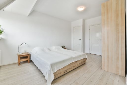A modern room with furniture and the bright light coming from the window