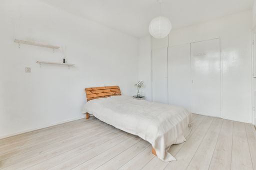 A modern room with furniture and the bright light coming from the window