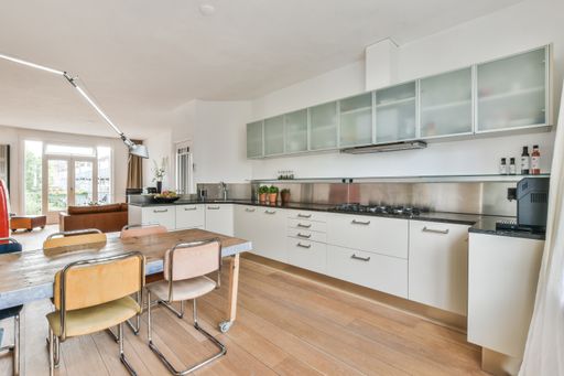 A modern room with furniture and the bright light coming from the window