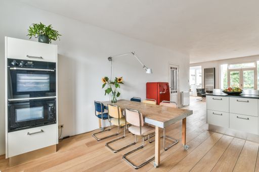 A modern room with furniture and the bright light coming from the window