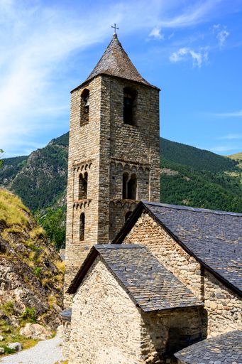 A vertical shot of Sant Joan de Boi church in beautiful nature under the blue sky in Spain