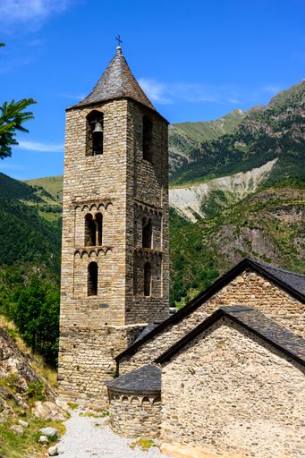 A vertical shot of Sant Joan de Boi church in beautiful nature under the blue sky in Spain