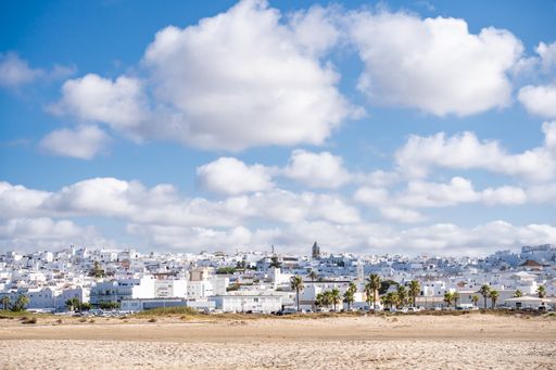 An aerial view of the traditional white buildings of the Conil de la Frontera town in Cadiz, Spain
