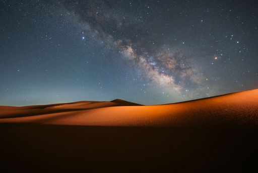 The Milky Way galaxy shining brightly over the sand dunes in Alxa Left Banner, Inner Mongolia