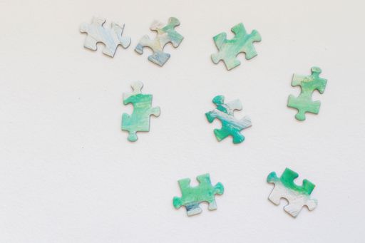 The colorful jigsaw puzzle pieces arranged on a white background