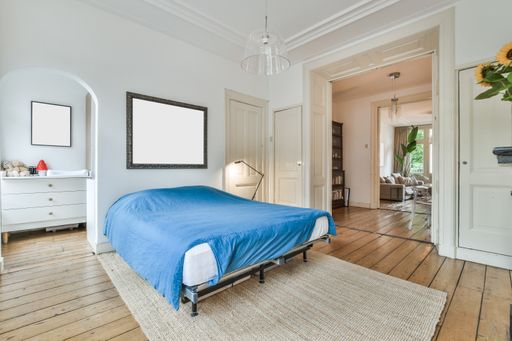 A modern room with furniture and the bright light coming from the window