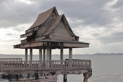 A covered part of a jetty, bridge, or pier made of steel concrete, which is located in a deserted place by the sea in Thailand Southeast As