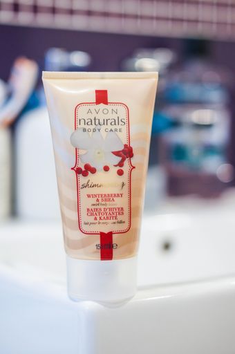The Avon Naturals skin cream on a sink