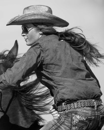 Blaze Peterson riding hard  at a gymkhana event in Kelvington Saskatchewan, Canada