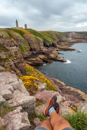 A vertical shot of the coastline next to the Phare Du Cap Frehel lighthouse in Cotes-d'Armor, France