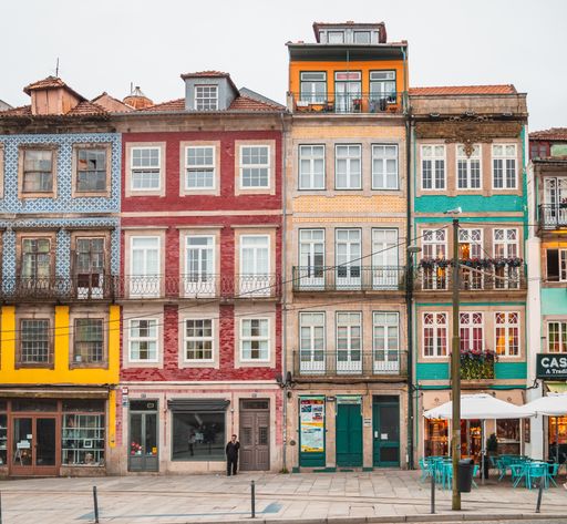 An assortment of a typical set of colorful European buildings next to each other in Porto, Portugal.