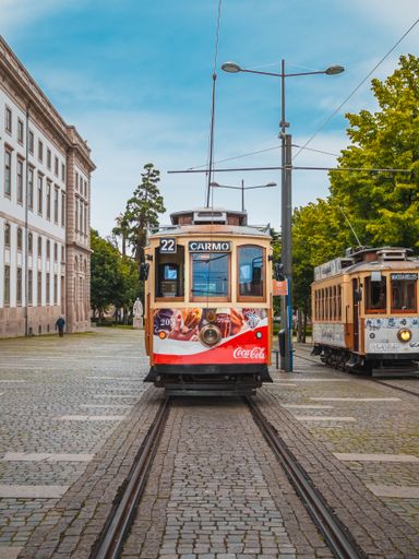 A vertical shot of the famous Heritage coca cola tram called Electrico in the center of Porto, Portugal.