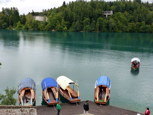 A lake with boats near the dock in Slovenia