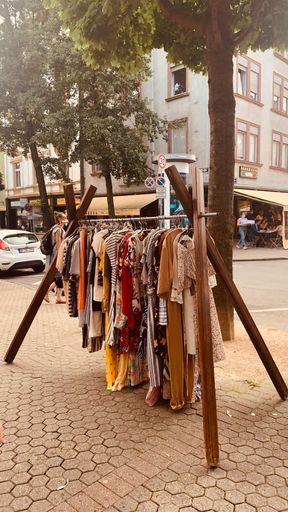 A vertical shot of an outdoor clothing store