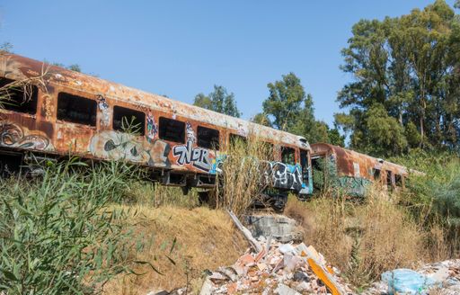 An old rusty abandoned train carriages in Marbella, Spain