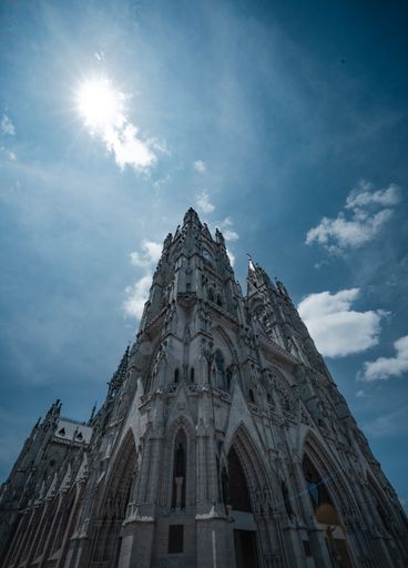 A beautiful low angle view of the Basilica del Voto Nacional on a sunny day