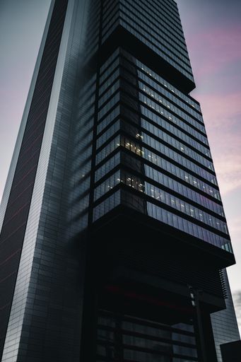 A low angle view of the beautiful skyscraper during the sunset