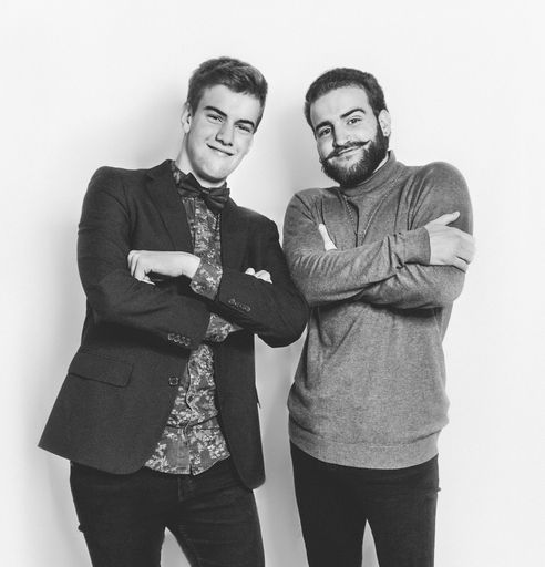 A grayscale shot of attractive Spanish models in fashionable outfits