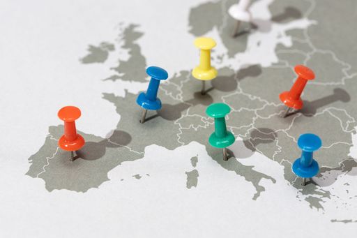 Colorful pins mark various locations on a detailed map of Europe.